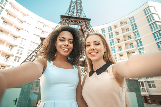 Young women travel together paris vacation abroad