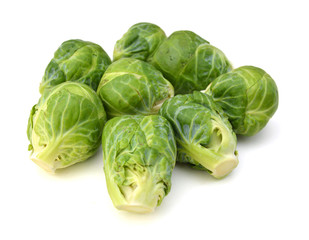a pile of Brussels sprouts on a white background