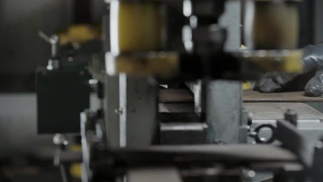 Manufacturing process cutting metal piece on modern metalworking machine