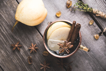 Cold Moscow Mule cocktail in copper mug on the rustic background. Shallow depth of field.