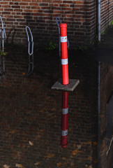 Reflection of pillar in the water