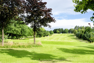 Fototapeta premium Green golf field in Alexandra park in Glasgow, Scotland, UK