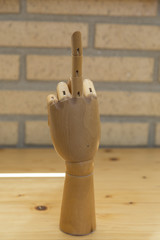 articulated wooden hand with raised heart finger