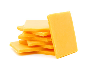 Cheddar cheese slices on white background.