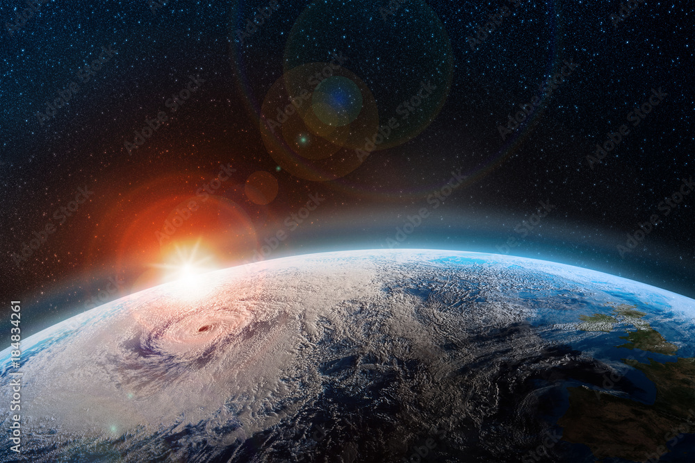 Aufkleber Dawn over the planet. A view from outer space to the surface of the Earth. Hurricane over the ocean. Elements of this image furnished by NASA