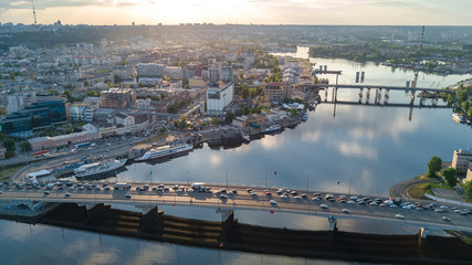 Aerial top view of Dnepr river and Rybalskiy island from above, bridges and skyline of Kiev city, Ukraine

