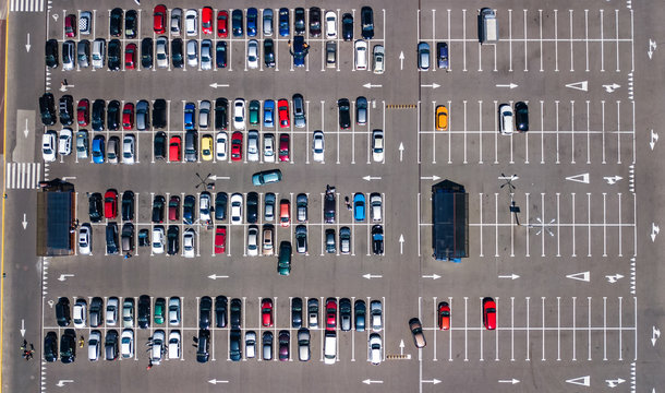 Aerial top view of parking lot with many cars from above, city transportation and urban concept
