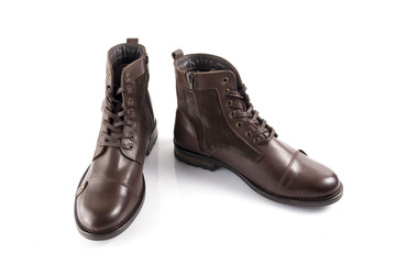 Male brown leather boot on white background, isolated product, comfortable footwear.