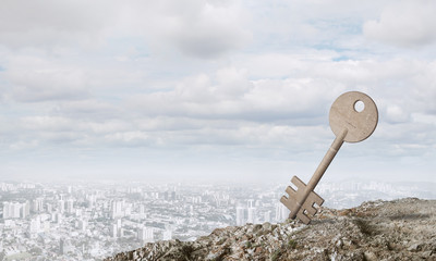 Conceptual background image of concrete key sign and natural landscape