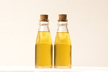 Oil in glass bottle with cork lid