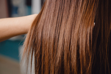 Master combs hair with his teeth in salon. Beautiful and healthy.