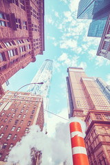 Looking up in New York City, color toned picture, USA.