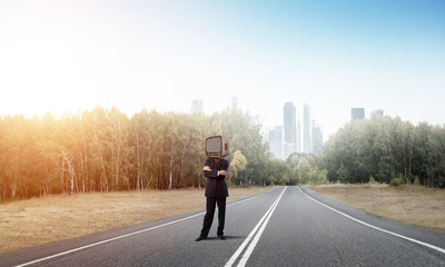 Businessman with old TV instead of head.