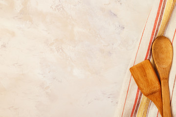 Kitchen background with towel and cooking tools.