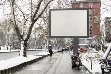 Blank advertising billboard on city street