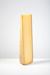 French cheese comté on grey background.