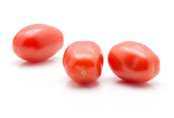 Cherry tomatoes Bobulienka isolated on white background three whole and fresh.