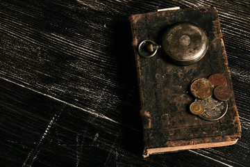 Fototapeta na wymiar Antique vintage pocket watch and old leather book 