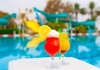 Drink. Alcohol cocktails, pool background