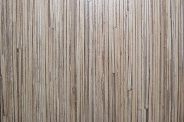 wooden floor of thin beige brown gray platelets bamboo straw texture of dry grass sawdust natural...