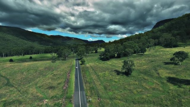 aerial shot of country road cars driving