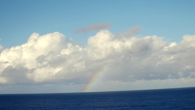 rainbow on the horizon and ocean