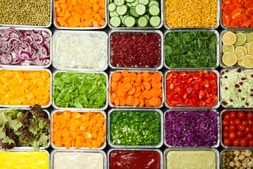Top view of salad bar with assortment of ingredients