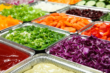Close up of salad bar with assortment of ingredients