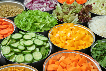 Close up of salad bar with assortment of ingredients