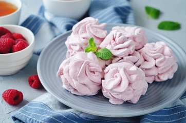 Fototapeta na wymiar Raspberry Zephyr on a plate with fresh raspberries and mint