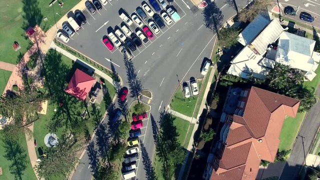 aerial view of cars going in and out of car park