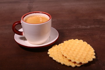 Wafel, caramel waffle and coffee cup, coffeebreak isolated on dark background