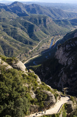 Panorama of mountains and forest stone path in river canyon from Montserrat region, Catalonia, Spain