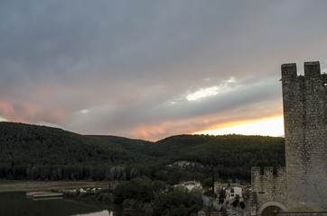 Sunset over lake and forest from medieval castle in Catalonia