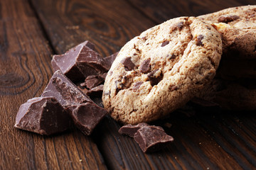 Chocolate cookies on wooden table. Chocolate chip cookies.