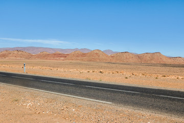 empty highway with yellow land in Sahara desert