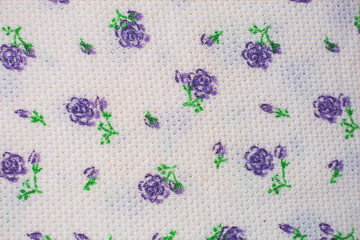 fabric background with small purple flowers