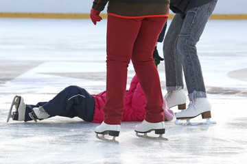 people skating on the ice rink.
