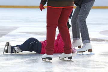 Fototapeta premium people skating on the ice rink.