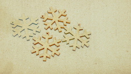 Wooden stars in retro style covered with sepia-colored texture. Image showing the festive atmosphere in the form of a Christmas card.