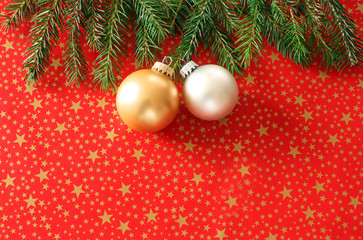 Christmas background  with golden and silver balls on red