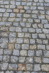 Old wet cobblestone. Paved street.
