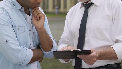 University teacher explaining student different approaches to solving problems
