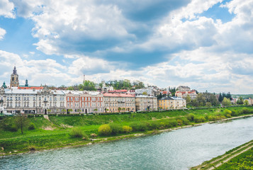 Beautiful river view and ancient buildings under white clouds and blue sky