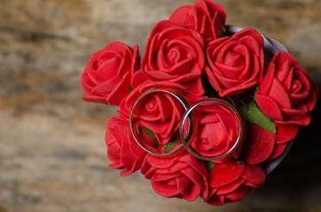 Red flowers and ringsholiday; love; saint; Valentine; day; red; wedding; white; guy; girl;...