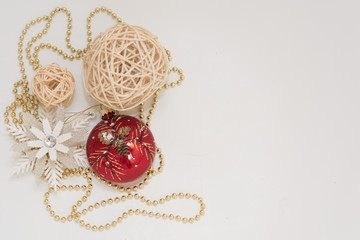 Christmas gift box with ribbon bow  and ball toy and cone on white wooden vintage background