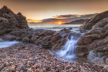 Ocean cascade at Rotherslade
A small cascade of seawater as the tide swells on the beautiful coastline of Rotherslade Bay, a small bay in South Gower next to the more famous Langland Bay.