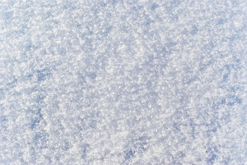 background, texture: soft, fluffy surface of freshly fallen snow with distinguishable individual...