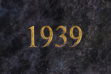 The number 1939, engraved in gold letters on marble. - obrazy, fototapety, plakaty