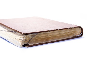 Closeup of old vintage book on the white background
